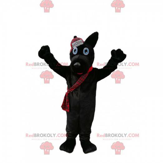Schwarzes Hundemaskottchen mit einer schottischen Artkappe -