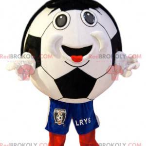 Sorridente mascotte pallone da calcio in pantaloncini blu -