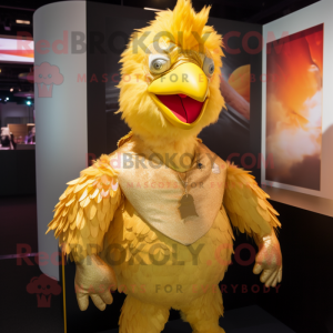 Gold Chicken mascot costume character dressed with a Rash Guard and Hair clips