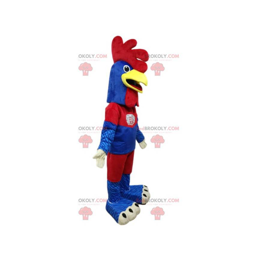 Hühnermaskottchen in blauer und roter Sportbekleidung -