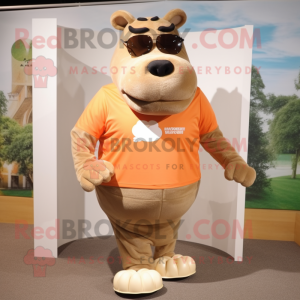 Tan Hippopotamus mascot costume character dressed with a Running Shorts and Sunglasses