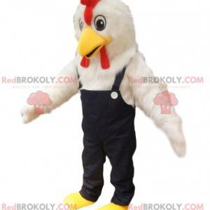 Mascotte de poulet blanc avec une salopette en jeans. -