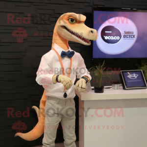 Peach Deinonychus mascot costume character dressed with a Oxford Shirt and Smartwatches