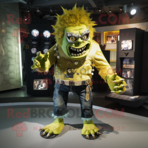 Gold Frankenstein'S Monster mascot costume character dressed with a Skinny Jeans and Brooches