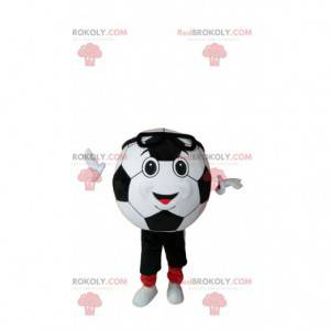 De glimlachende mascotte van de voetbalbal in sportkleding -
