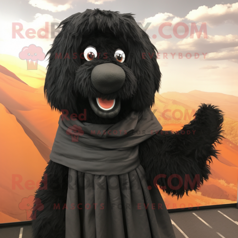 Black Shepard'S Pie mascot costume character dressed with a Romper and Shawl pins Black Shepard'S Pie mascot costume character dressed with a Romper and Shawl pins