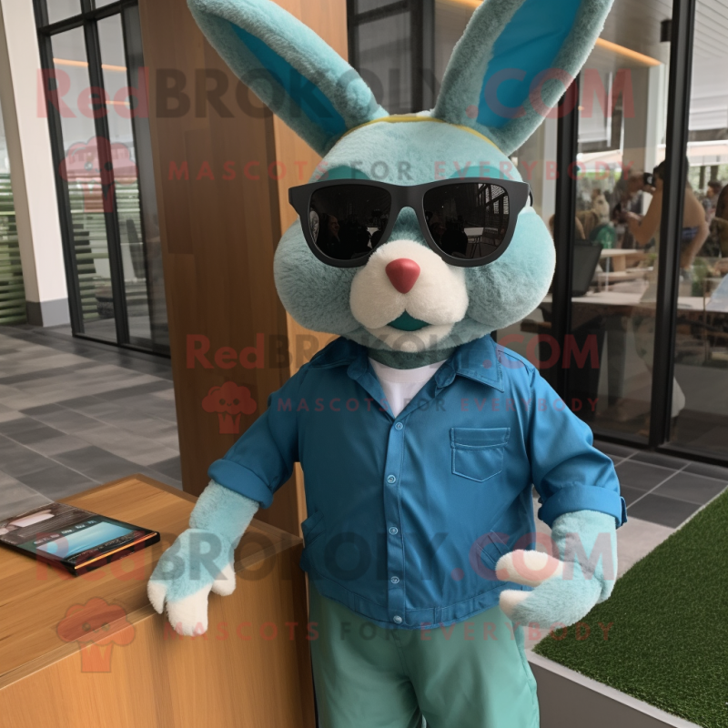 Teal Wild Rabbit mascot costume character dressed with a Oxford Shirt and Sunglasses Teal Wild Rabbit mascot costume character dressed with a Oxford Shirt and Sunglasses