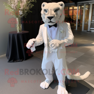 White Smilodon mascot costume character dressed with a Empire Waist Dress and Bow ties