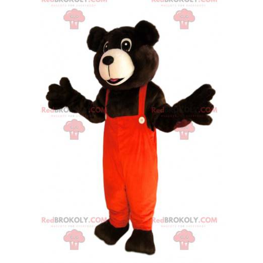 Braunbärenmaskottchen mit orangefarbenem Overall -