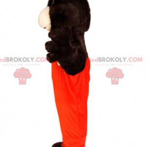 Braunbärenmaskottchen mit orangefarbenem Overall -