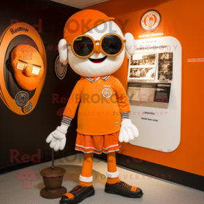 Orange Guinness mascot costume character dressed with a Henley Tee and Brooches