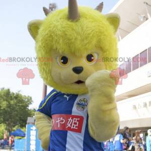 Yellow bear mascot of fantastic creature with horns -