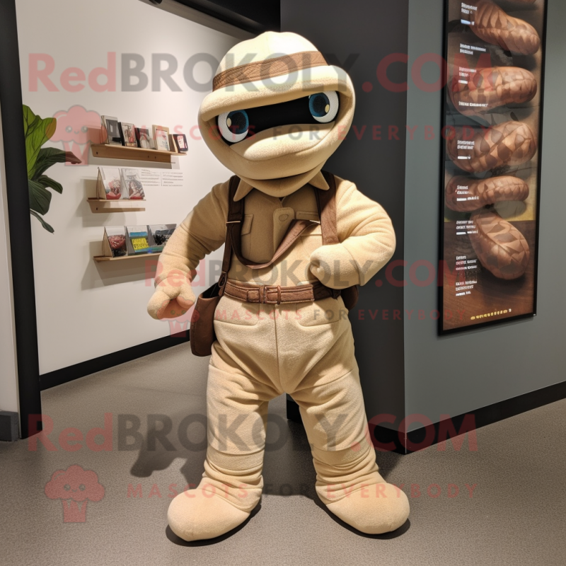 Tan Python mascot costume character dressed with a Dungarees and Handbags Tan Python mascot costume character dressed with a Dungarees and Handbags