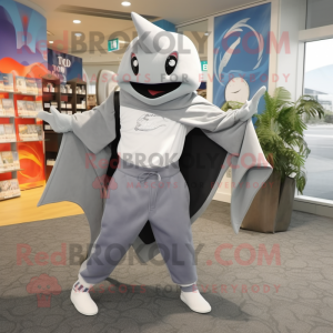 Gray Manta Ray mascot costume character dressed with a Long Sleeve Tee and Clutch bags