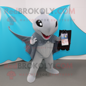 Gray Manta Ray mascot costume character dressed with a Long Sleeve Tee and Clutch bags