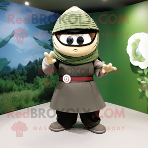 Olive Samurai mascot costume character dressed with a Maxi Dress and Caps