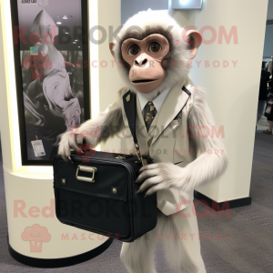 Silver Capuchin Monkey mascot costume character dressed with a Suit Jacket and Messenger bags