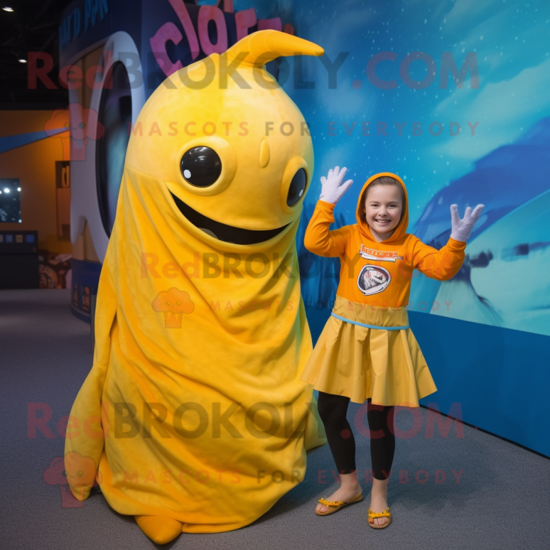 Yellow Narwhal mascot costume character dressed with a Wrap Skirt and Mittens