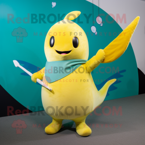 Yellow Narwhal mascot costume character dressed with a Wrap Skirt and Mittens