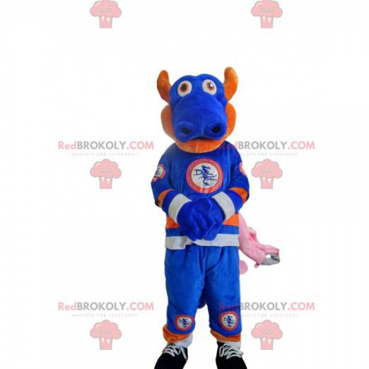 Blue and orange dragon mascot in sportswear. - Redbrokoly.com