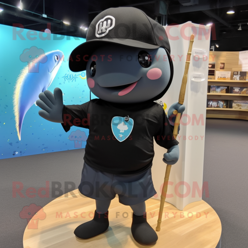 Black Narwhal mascot costume character dressed with a Board Shorts and Hat pins