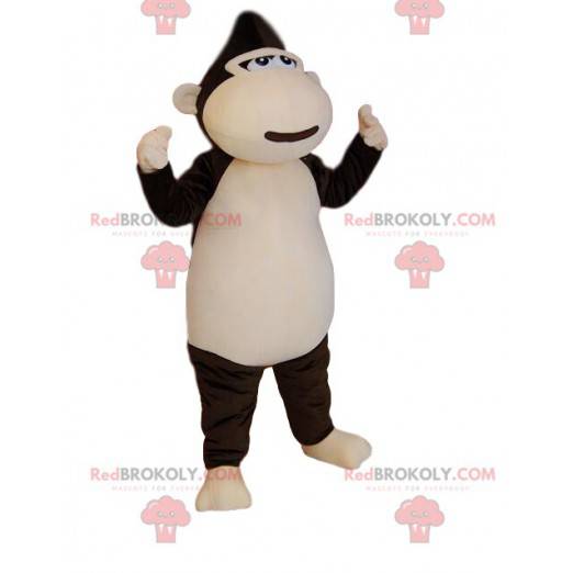 Mascotte scimmia marrone e crema molto felice. Costume da