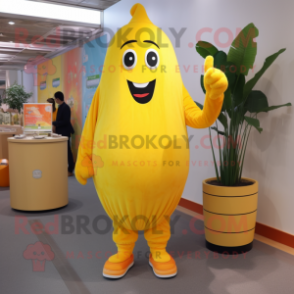 Yellow Apricot mascot costume character dressed with a Flare Jeans and Gloves