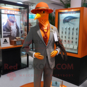 Orange Passenger Pigeon mascot costume character dressed with a Suit and Necklaces