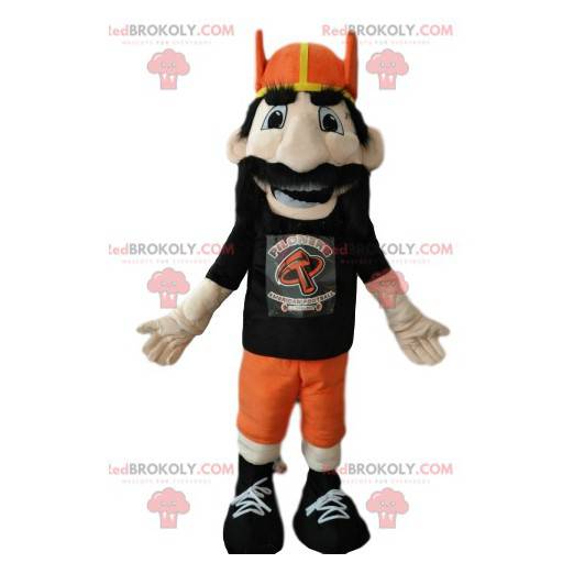 Vousatý muž maskot s oranžovou vikingskou helmou -