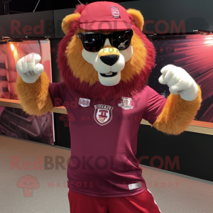 Maroon Tamer Lion mascot costume character dressed with a Henley Tee and Sunglasses