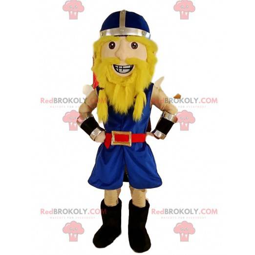 Mascota vikinga en traje azul tradicional, con su casco -