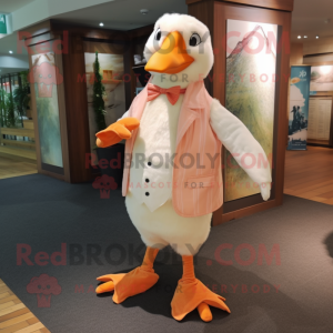 Peach Albatross mascot costume character dressed with a Waistcoat and Anklets