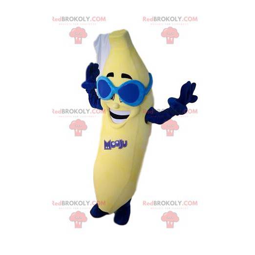 Mascotte de banane joyeuse, avec des lunettes de soleil bleues