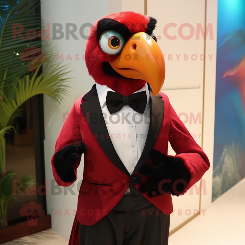 Maroon Macaw mascot costume character dressed with a Tuxedo and Tie pins