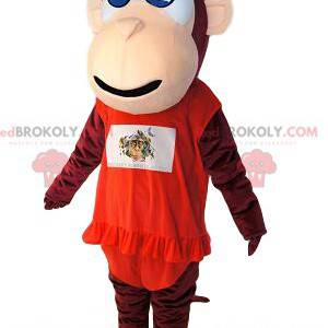 Mascot mono marrón, con un vestido rojo con volante. -