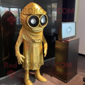 Gold Cyclops mascot costume character dressed with a A-Line Dress and Tie pins