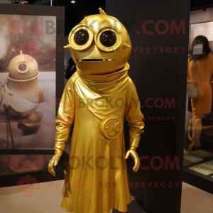 Gold Cyclops mascot costume character dressed with a A-Line Dress and Tie pins
