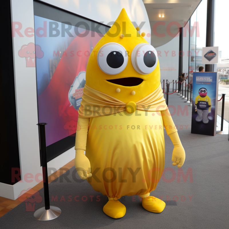 Gold Cyclops mascot costume character dressed with a A-Line Dress and Tie pins Gold Cyclops mascot costume character dressed with a A-Line Dress and Tie pins