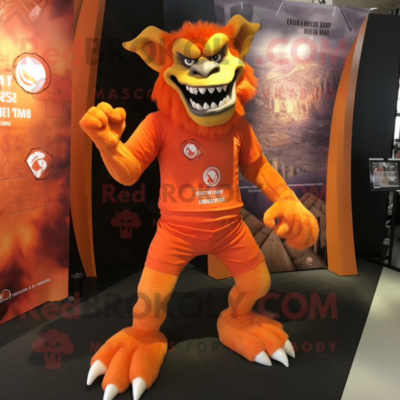 Orange Gargoyle mascot costume character dressed with a Rash Guard and Anklets Orange Gargoyle mascot costume character dressed with a Rash Guard and Anklets