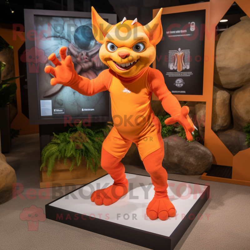 Orange Gargoyle mascot costume character dressed with a Rash Guard and Anklets Orange Gargoyle mascot costume character dressed with a Rash Guard and Anklets