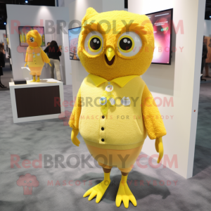 Yellow Owl mascot costume character dressed with a Cardigan and Earrings