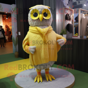 Yellow Owl mascot costume character dressed with a Cardigan and Earrings