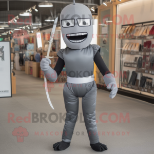 Gray Knife Thrower mascot costume character dressed with a Jeggings and Belts