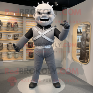 Gray Knife Thrower mascot costume character dressed with a Jeggings and Belts