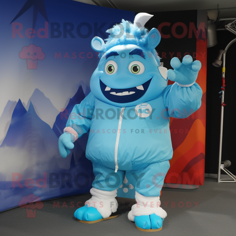Sky Blue Ogre mascot costume character dressed with a Windbreaker and Caps Sky Blue Ogre mascot costume character dressed with a Windbreaker and Caps