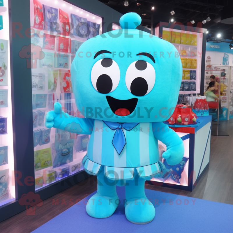 Cyan Candy Box mascot costume character dressed with a Cover-up and Suspenders Cyan Candy Box mascot costume character dressed with a Cover-up and Suspenders