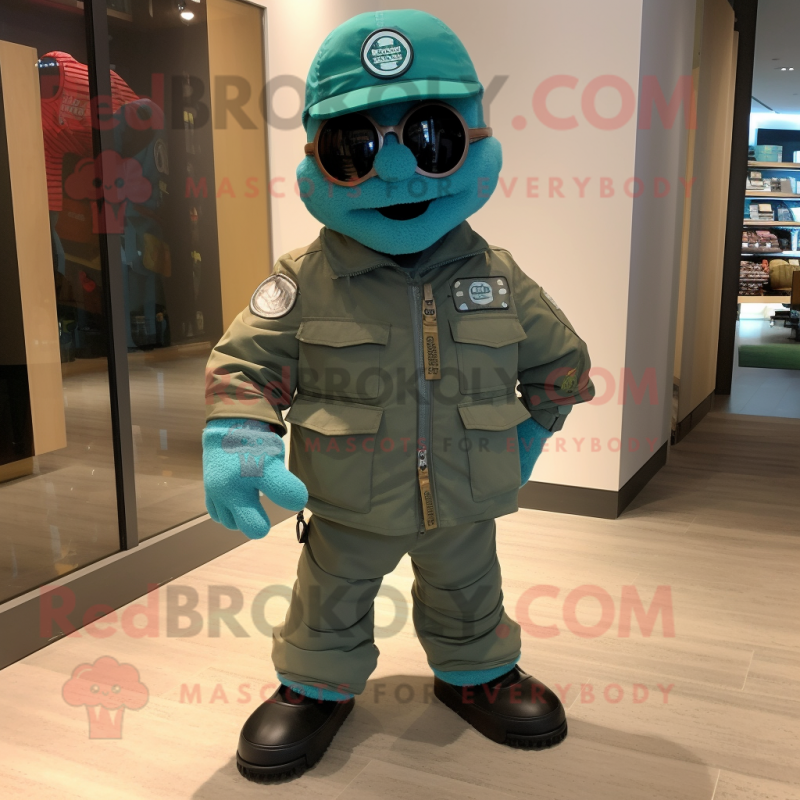 Turquoise Green Beret mascot costume character dressed with a Moto Jacket and Shoe laces Turquoise Green Beret mascot costume character dressed with a Moto Jacket and Shoe laces