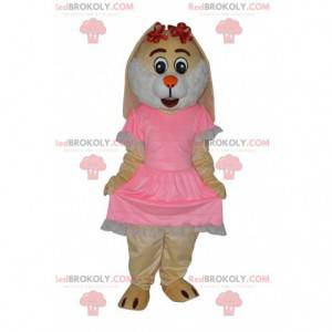 Mascota de conejo crema con un bonito vestido rosa -