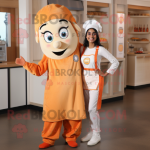Peach Tikka Masala mascot costume character dressed with a Overalls and Rings