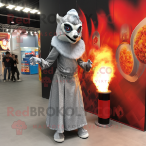 Silver Fire Eater mascot costume character dressed with a Shift Dress and Shawls